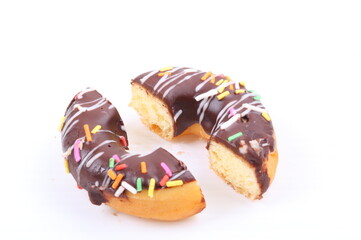 Chocolate sweet mini donuts on white background