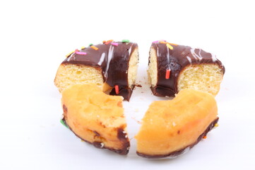 Chocolate sweet mini donuts on white background