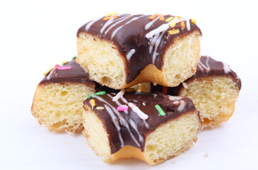 Chocolate sweet mini donuts on white background