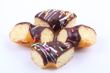 Chocolate sweet mini donuts on white background