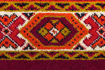 Retro carpet texture with hand-made decorative geometric pattern