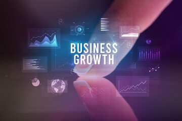 Finger touching tablet with business graphs and icons concept
