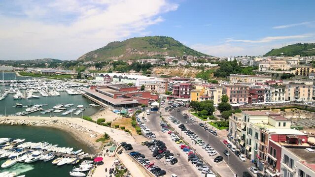 Amazing aerial view of beautiful port of Pozzuoli in summer season, Italy. Drone viewpoint