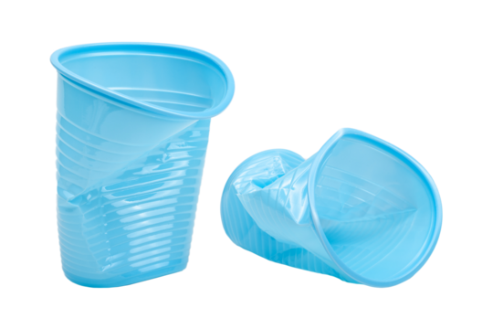 Crushed, damaged, discarded blue empty plastic cups, objects isolated on white background, cut out. Used plastic beverage cup trash, throwing away used plastic water cups, garbage, rubbish concept