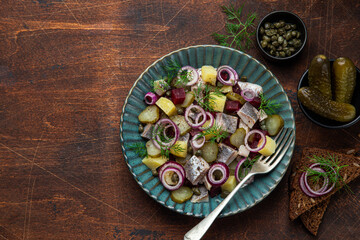 herring,  pickled cucumber, beet and  potato salad