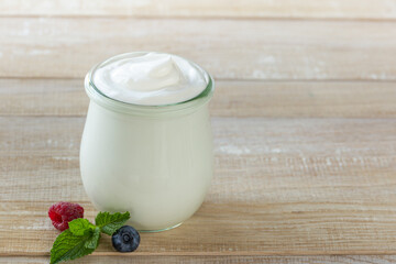 fresh greek yogurt in glass jar