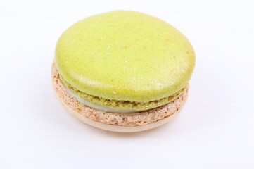 Green macaron isolated in white background