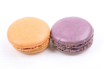 Purple and cream macaron isolated in white background