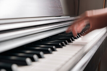 Close-up Of blurry hand fast Playing Piano