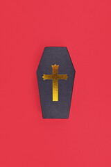 Obraz premium Coffin shaped Halloween cardboard gift box on red background