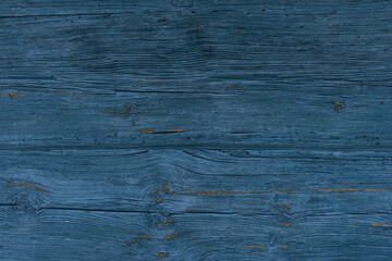 Old blue-painted barn wall. Rustic wooden planks texture for background or HD wallpaper