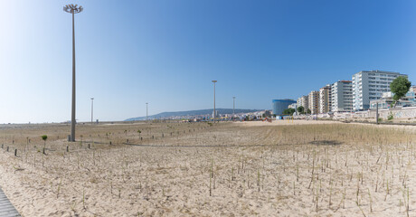 Fototapeta na wymiar Amazing panoramic view of Figueira da Foz, Claridade beach with pedestrian walkways and main Brazil avenue, along the seafront with buildings