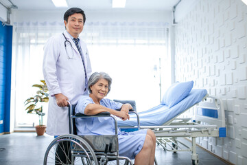 Asian doctor help and take care of senior patient at recover room in hospital, Healthcare and...
