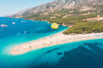 Parasailing over the Adriatic Sea near the island of Brac, Croatia.