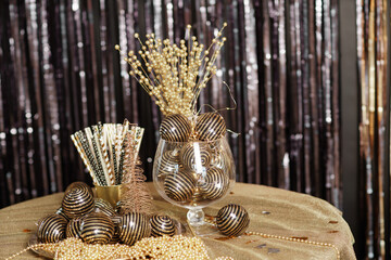 Bright Christmas decor. Christmas and New Year interior in black and gold colors. Winter holiday background
