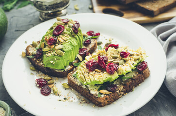 Healthy avocado toasts for breakfast or lunch with rye bread