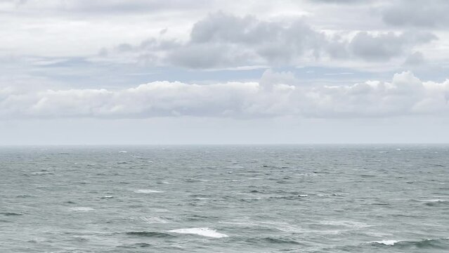Waters and cloudy skies over an ocean as hurricane Kay passes through