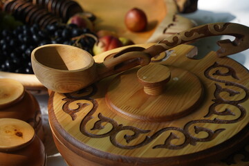 Wooden carved tableware with Kazakh national pattern