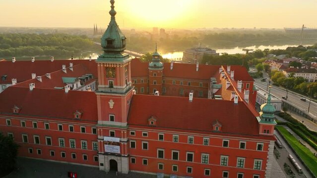 Warsaw old town at sunrise, aerial view of medieval royal castle in the capital of Poland with the clock tower, unesco tourist attraction in Poland