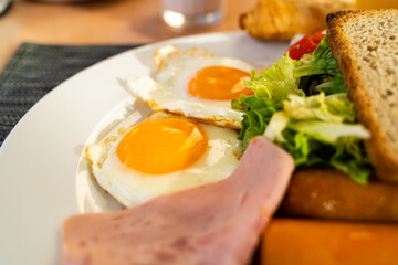 Breakfast with eggs sunny side in a cafe on vacation
