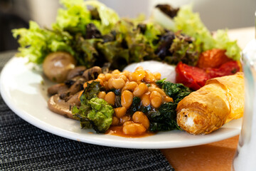 Vegetarian breakfast with beans and greens