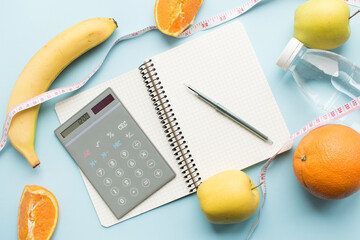 Paper notebook with calculator and pen
