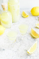Italian traditional liqueur limoncello with lemon