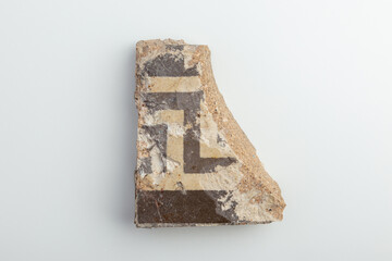 A shard of patterned floor tiles from an ancient mansion