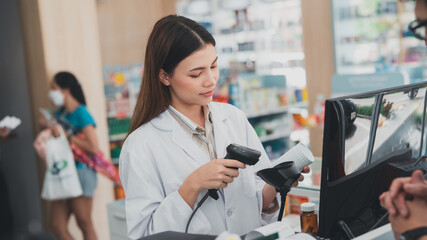 Fototapeta na wymiar female pharmacist at drugstore.Health care pharmacists work at the hospital.Pharmacist looking at male customer.Doctor specialists organize prescription medications.