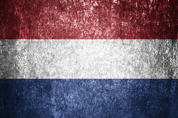 Closeup of grunge Dutch flag.  Dirty Flag of the Netherlands on a metal surface.