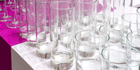 Glass glasses on the table. Serving in a restaurant.