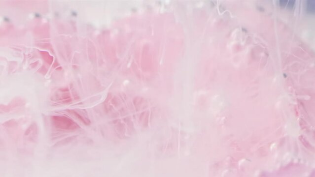 Flower smoke motion. Stock footage. Underwater illusion with paint spreading along the petals of a flower underwater.