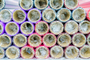 A roll of wrapping paper on a shelf in a store.