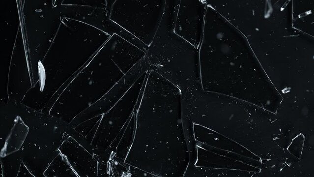 Super Slow Motion Shot of Breaking Real Glass at 1000 fps. Isolated on Black Background.