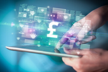 Close-up of a hand using tablet, currency concept