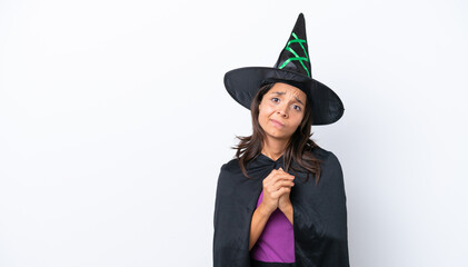 Young hispanic woman dressed as witch over isolated background laughing