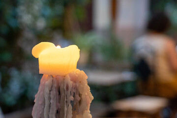 Candle with wax flowing from it 