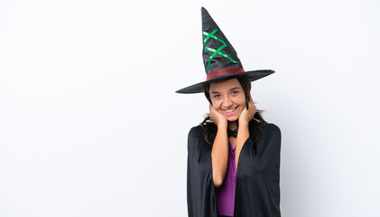 Young hispanic woman dressed as witch over isolated background laughing