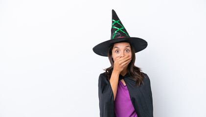 Young hispanic woman dressed as witch over isolated background covering mouth with hand