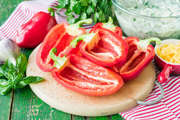 Halves of bell pepper. Stuffed bell pepper. Bell pepper with cottage cheese and herbs.