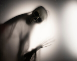 Shadow blur of horror skeleton. Halloween background.