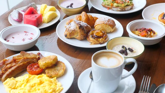 Wooden table full of various food in luxury restaurant, cafe breakfast 