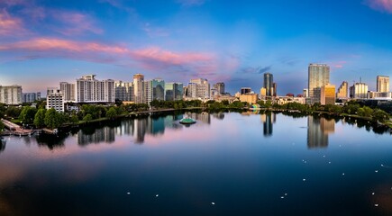Aerial view of lake Eola and the Orlando city skyline at sunrise