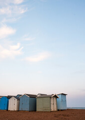 Obraz na płótnie Canvas Beach Huts On Teignmouth's Back Beach At Sunset