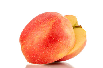 Two halves of juicy red apples, macro, isolated on white background.