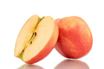 Two halves of juicy red apples, macro, isolated on white background.