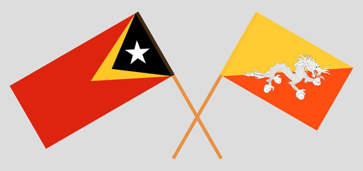 Crossed flags of East Timor and Bhutan. Official colors. Correct proportion
