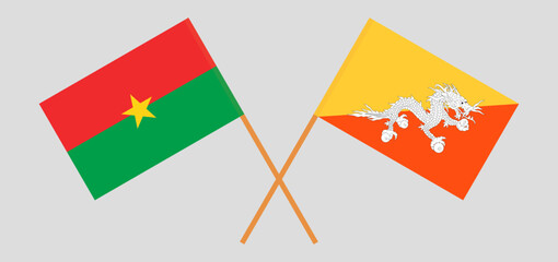 Crossed flags of Burkina Faso and Bhutan. Official colors. Correct proportion
