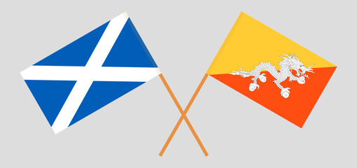 Crossed flags of Scotland and Bhutan. Official colors. Correct proportion