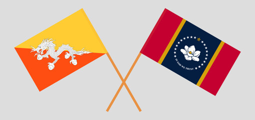 Crossed flags of Bhutan and The State of Mississippi. Official colors. Correct proportion